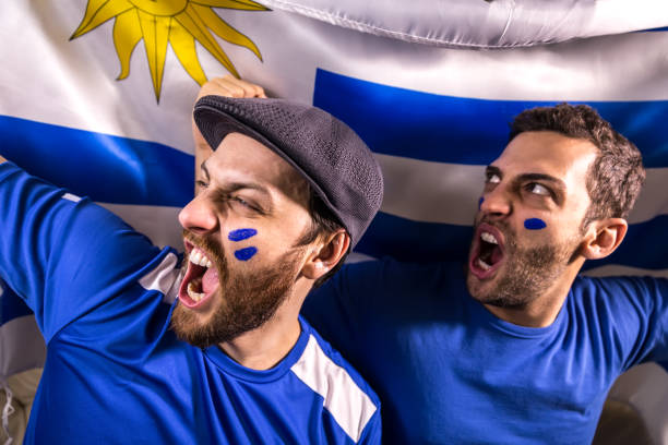 istock Uruguayan fans holding the national flag 826708494