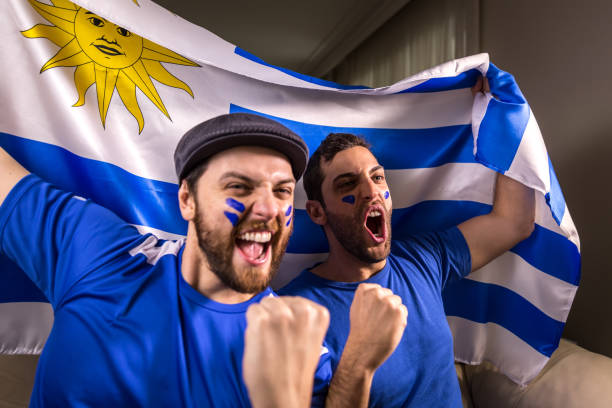 istock Uruguayan fans holding the national flag 826708532