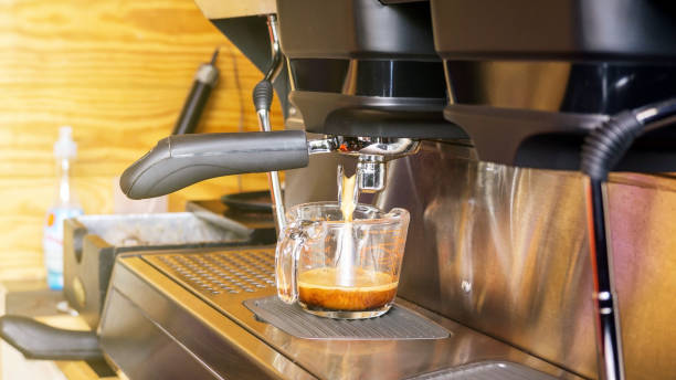 istock Brewing a coffee using a coffee machine in a coffee shop. 826709392