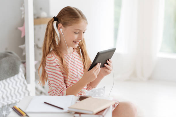 istock Child watching cartoons on digital tablet 826712136