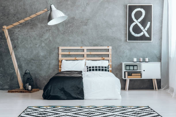 istock Concrete wall in simple dark room 826712304