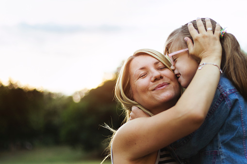 Close life moments between mother and daughter. Real people, genuine emotions.