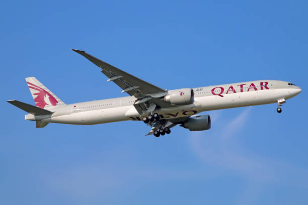 Shanghai, China - May 30, 2017: A Boeing 777-300/ER operated by Qatar Airways approaches Shanghai Pudong airport for landing.