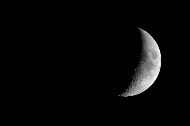 istock Waxing crescent moon seen with telescope 826717186