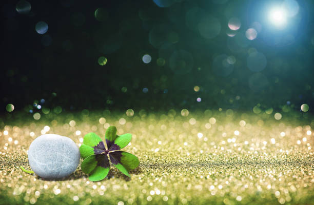 istock Abstract background with four leaf lucky clover and stone 826717230