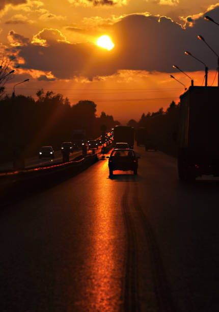 istock Highway cars driving into the sunset. Blur. 826719782