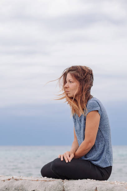 istock Woman alone and depressed at seaside 826724728