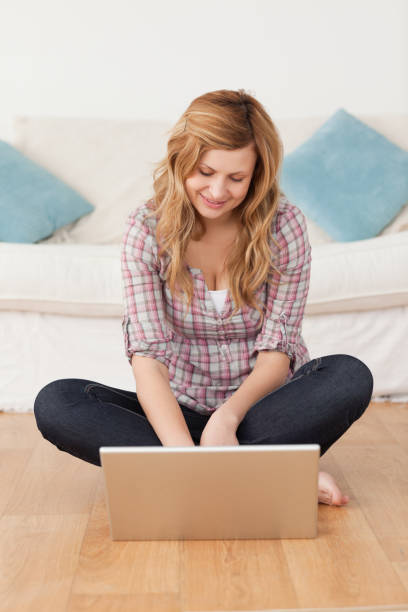 istock Smiling woman surfing on her laptop 826725072