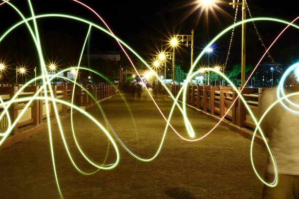 istock Abstract motion blurred lights on night city background. 826725674