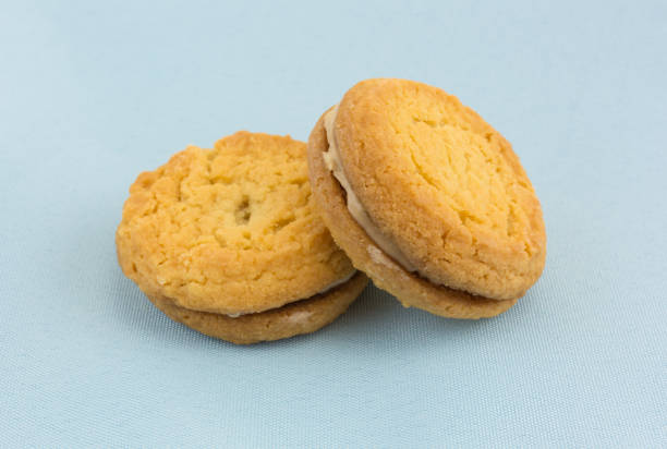 istock Sugar cookies with hazelnut filling on a napkin 826728594