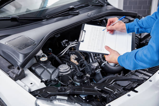 istock Auto mechanic working on a car engine in repair shop. 826729292