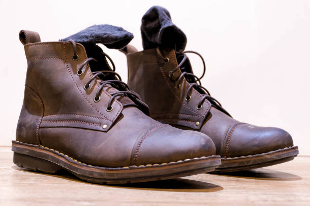 istock vintage boot shoes on white background 826729600