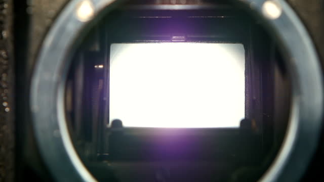 Closeup shot of diaphragm camera shutter blade in slow motion