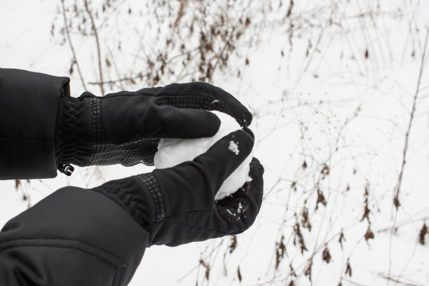 istock preparing for a snowball fight 826740204