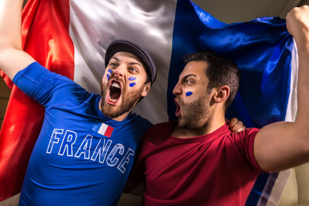 istock French fans holding the national flag 826740836