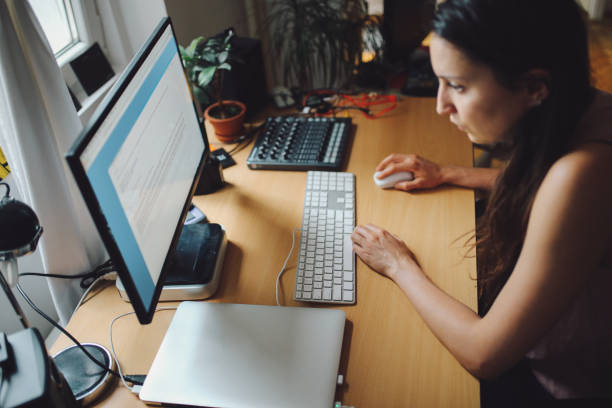 istock Woman working in a home apartment workstudio 826747378