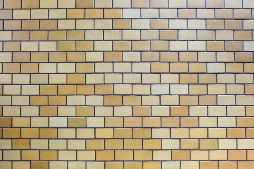 closeup texture of brown bricks tiles on the wall