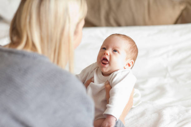 istock Mother laying down her newborn 826751308