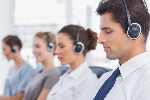 istock Group of agents sitting in line in a call centre 826751766