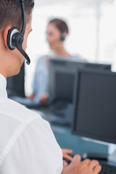 istock Business man working in a call centre 826752566