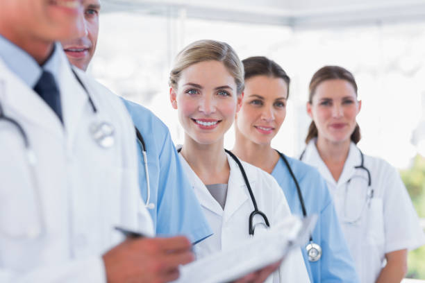 istock Smiling medical team in row 826753402
