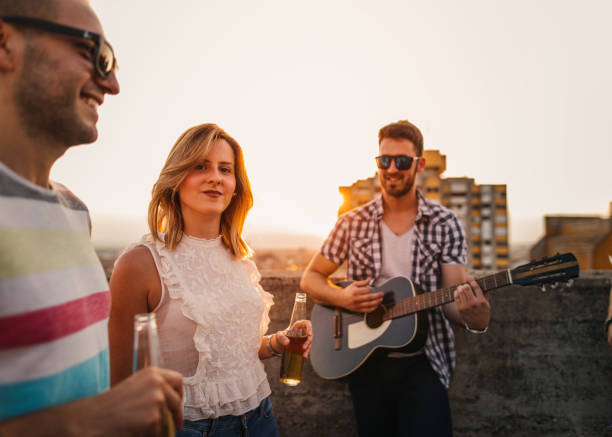 istock Happy friends dancing at the roof 826753714
