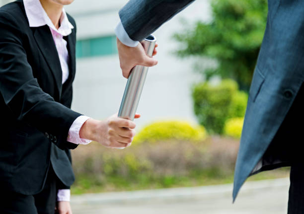 istock Business people passing baton 826756976