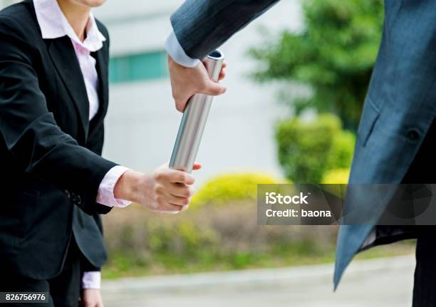 Business People Passing Baton Stock Photo - Download Image Now - Relay Baton, Passing - Giving, Business