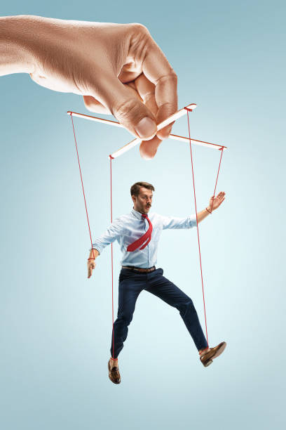 istock Businessman puppet on gray background 826757660