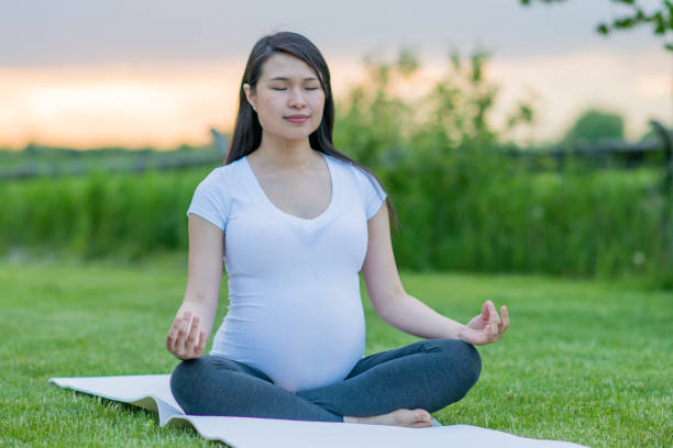 istock Yoga In A Field 826760652