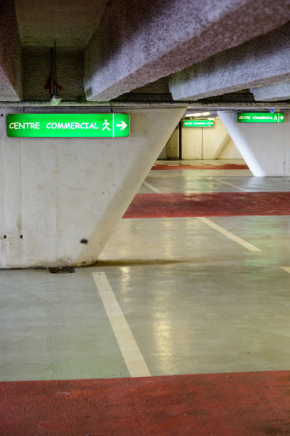 istock Luminous signs in an underground parking lot 826763262