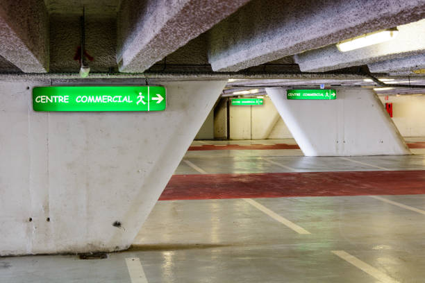 istock Luminous signs in an underground parking lot 826763688