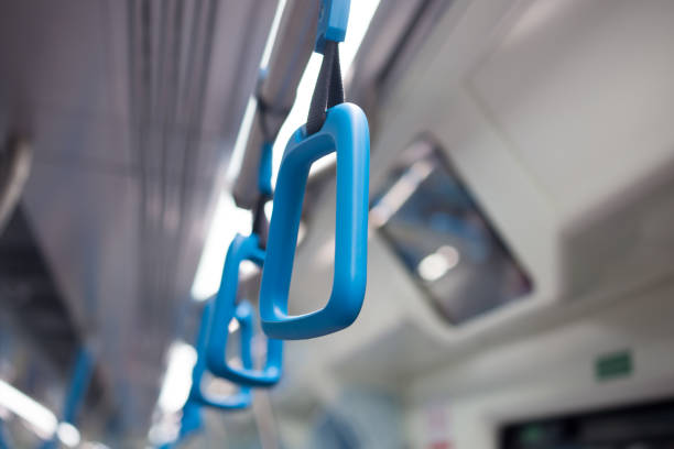 istock Blue plastic handles on ceiling rails for standing passenger, handle in underground railway or Mass Rapid Transit (MRT), use for people holding on the train or the bus prevent toppling selective focus 826763724