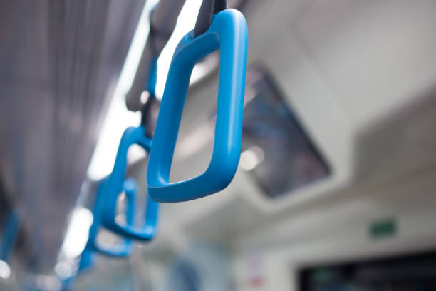 istock Blue plastic handles on ceiling rails for standing passenger, handle in underground railway or Mass Rapid Transit (MRT), use for people holding on the train or the bus prevent toppling selective focus 826763726