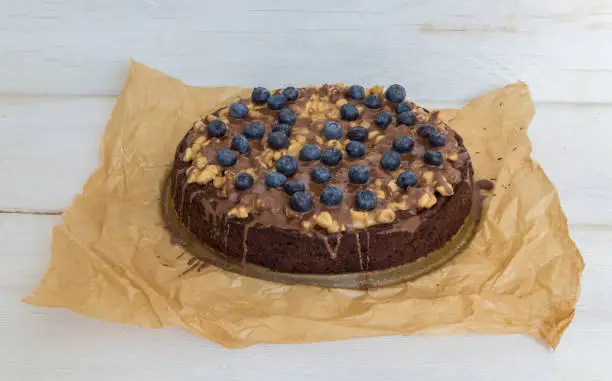 Chocolate cake with peanut caramel and blueberries.