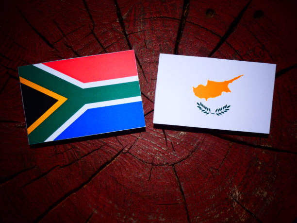 istock South African flag with Cypriot flag on a tree stump isolated 826766530