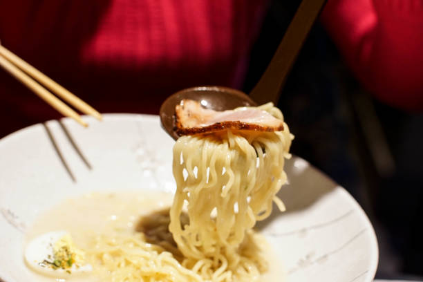istock eating ramen noodle in a japanese restaurant 826767460