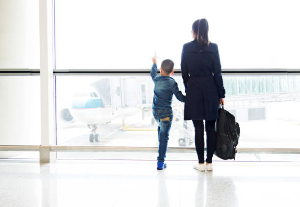 Young mother and son at airport