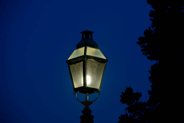 istock Old historic street light at night 826768044