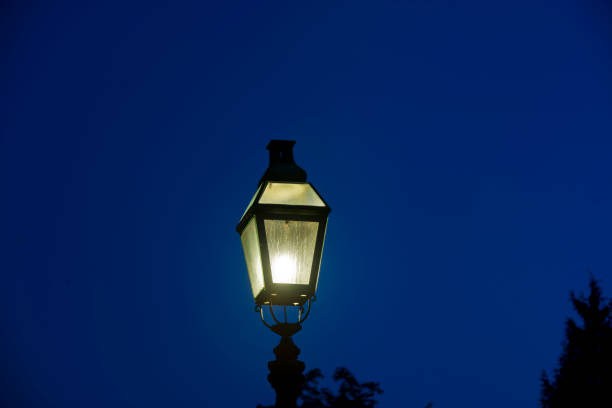 istock Old historic street light at night 826768072