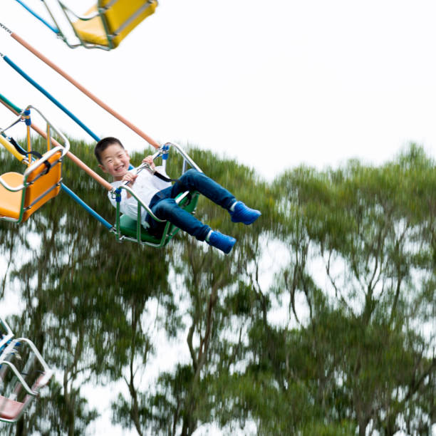 istock Little boy on a swinging ride 826775502