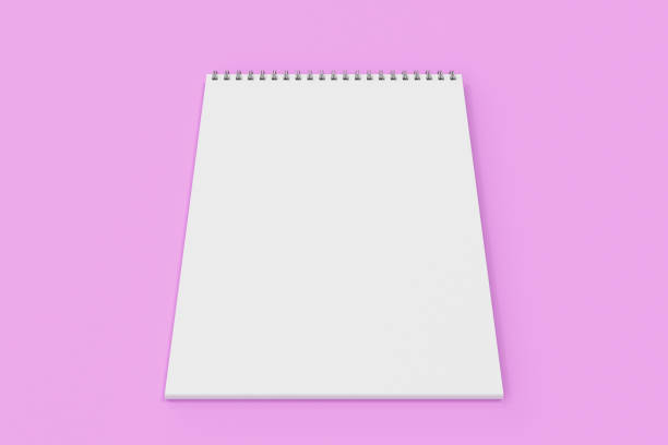 istock Blank white notebook with metal spiral bound on violet background 826781854