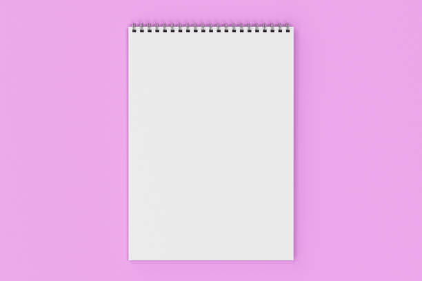istock Blank white notebook with metal spiral bound on violet background 826781904