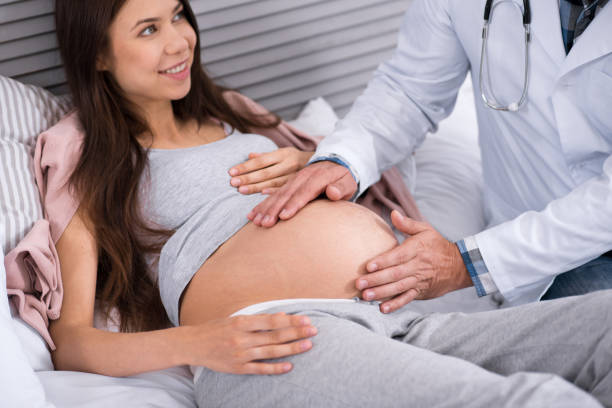 istock Happy future mommy lying on the bed 826782464
