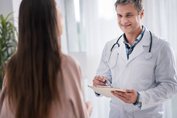 istock Attractive doctor visiting his pregnant patient 826785888
