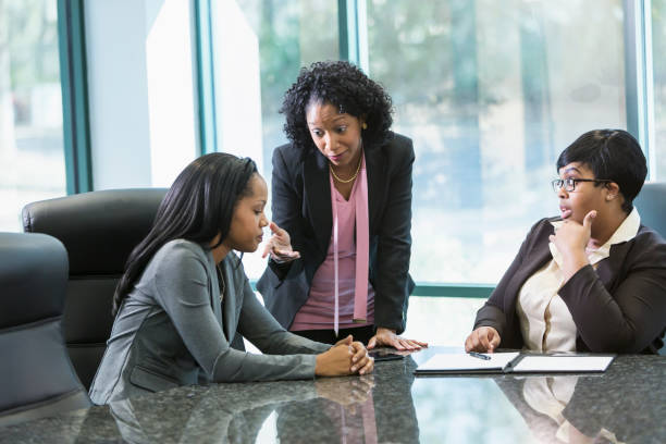istock Three black women in business meeting 826788816