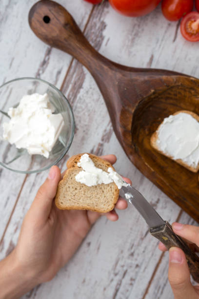 istock Butter and bread for breakfast, over rustic wooden background close up 826789082