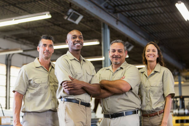 istock Four trucking company workers in garage 826789128