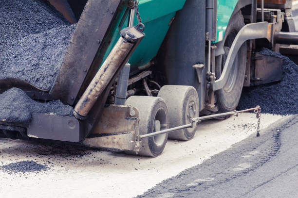 istock Paver makes the new asphalt on the road 826792532