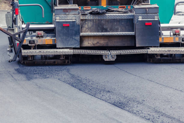 istock Paver makes the new asphalt on the road 826792572